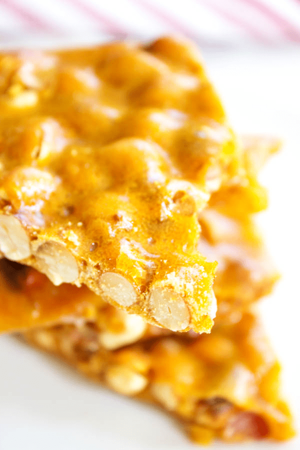 Making my GRANDMA'S PEANUT BRITTLE is one of my favorite holiday traditions. This classic treat of salty-sweet perfection, is surprisingly easy to make. GRANDMA'S PEANUT BRITTLE close up piece