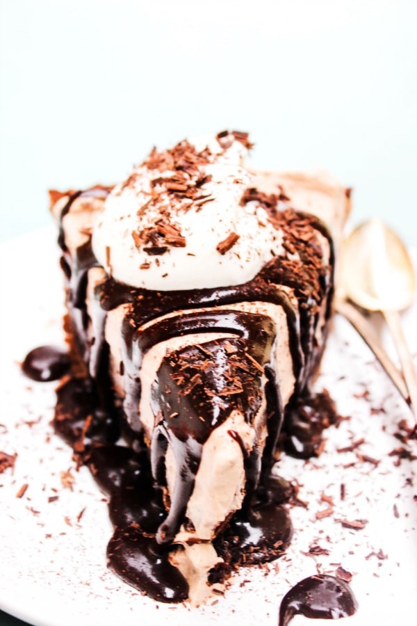 Mile High Fudge Brownie Pie slice chocolate pie crust, chocolate whipped cream, pudding, hot fudge sauce recipe, chocolate shavings