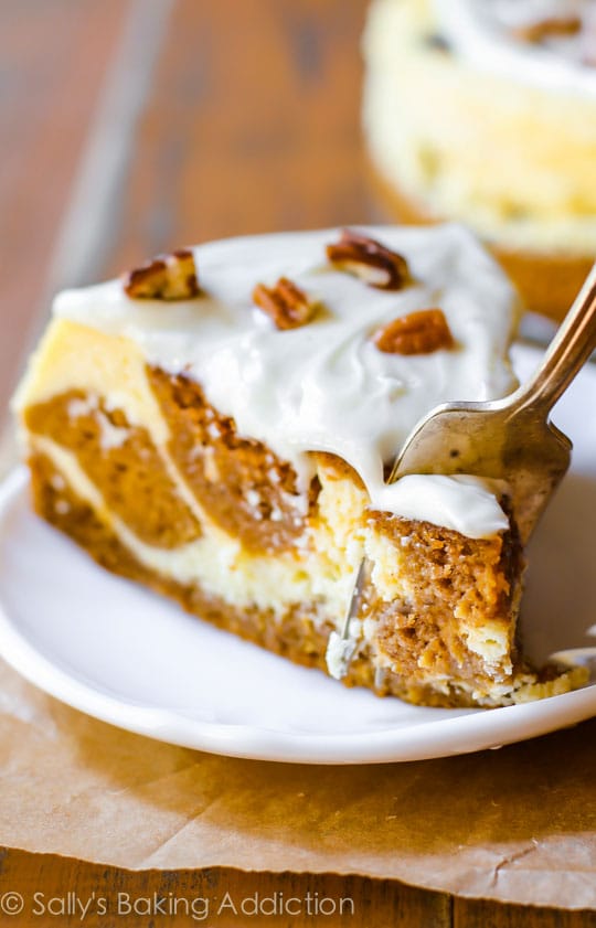 Pumpkin Cake Cheesecake swirled pie with sugar icing and pecans