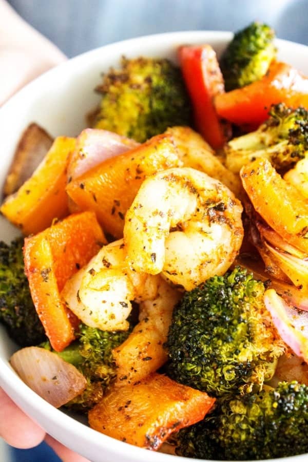 SHEET PAN CAJUN SHRIMP - simple, wholesome and full of classic Cajun flavors, the best part of this recipe is that it is ready in 20 minutes. SHEET PAN CAJUN SHRIMP - Completed in dish in white bowl