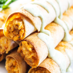 BAKED TACO RANCH TAQUITOS - Filled with a cheesy taco ranch chicken and then baked to perfection, they are perfect for any game day or holiday get together.