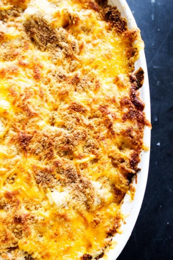BEST EVER TUNA NOODLE CASSEROLE - creamy, cheesy and completely delicious, this casserole is even adored by those who say they hate Tuna Noodle Casserole. top view of Tuna Noodle Casserole in white serving dish topped with panki bread crumbs