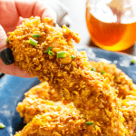 Ready in 30 minutes, baked to perfection and dipped in a simple honey garlic sauce these BAKED HONEY GARLIC CHICKEN TENDERS are out of this world.