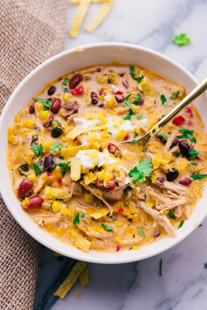 Chicken Tortilla Soup Crock Pot is full of flavor, easy to prepare and makes the house smell amazing. A perfect fall recipe & one that feeds a crowd.