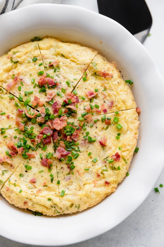 A lightened up recipe on a brunch classic this Bacon Chive Crustless Quiche is simple, easy and delicious. Adding bacon makes everything incredible. A lightened up recipe on a brunch classic this Bacon Chive Crustless Quiche is simple, easy and delicious. Adding bacon makes everything incredible.